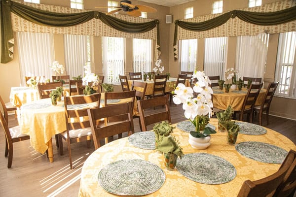 Dining area with decorated tables and flowers