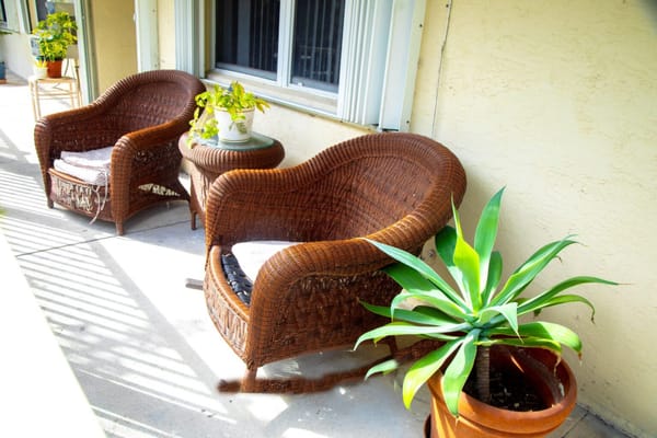 Cozy outdoor seating area with plants