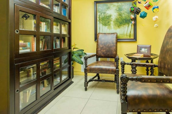 Cozy reading area with bookshelves and chairs