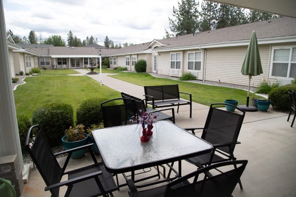 Outdoor seating area with tables and chairs