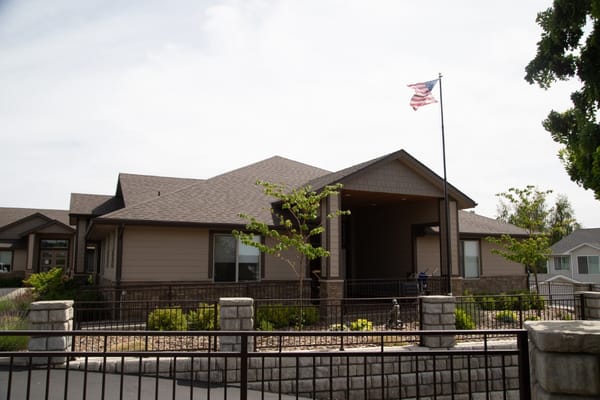 Exterior view of Providence Senior Home with landscaping