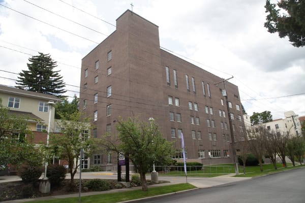 Exterior view of the facility building surrounded by trees