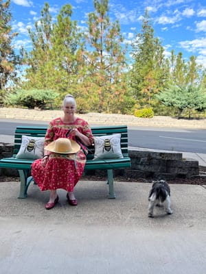 A resident enjoying the outdoors with a small dog