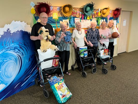 Residents engaging in a fun group activity in the common area