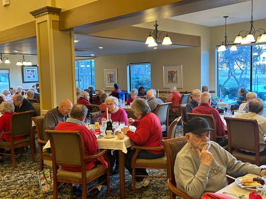 Residents enjoying a meal in the dining area