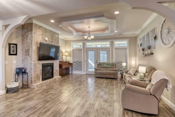 Spacious living room with seating and a fireplace