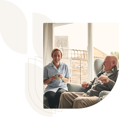 Caregiver and resident sharing a moment in a common area