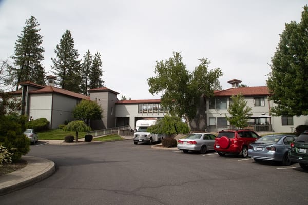 Exterior view of Fairwood Retirement Village with parking area