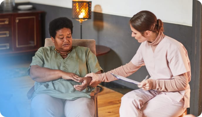 A staff member conducting care for a resident