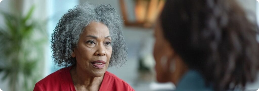 A woman engaging in conversation in a facility setting