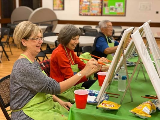 Residents participating in an art class activity