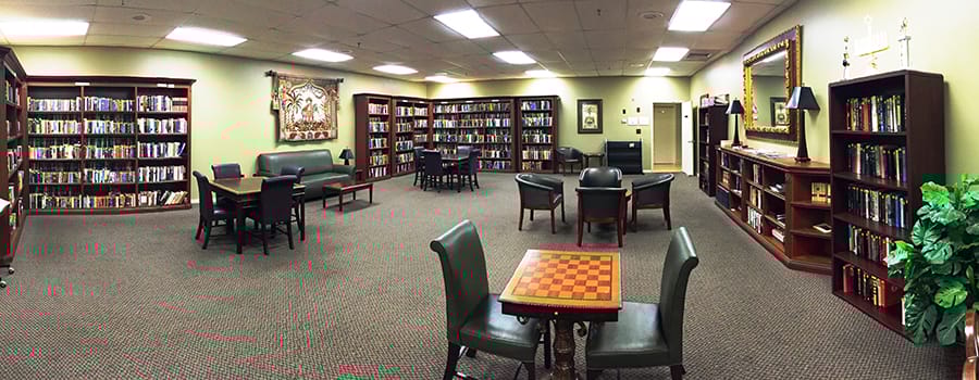 Bright interior of a library with bookshelves and seating