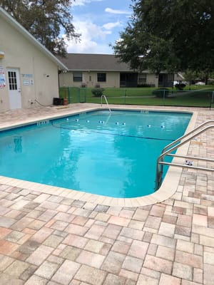 Swimming pool surrounded by patio area