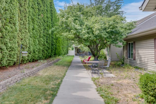 Pathway in a serene outdoor space with seating