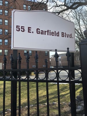 Sign for a nursing home on a street