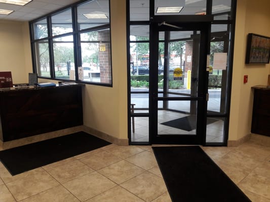Lobby entrance with glass doors and tile floors