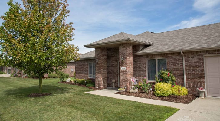 Exterior view of a senior living facility with landscaping