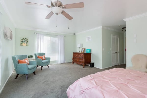 Bright interior view of a resident room with furniture