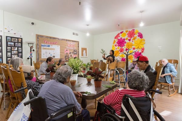 Residents participating in a group activity in a common area