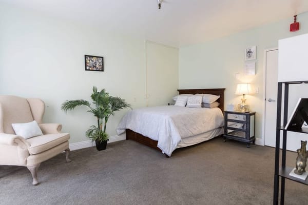 Cozy bedroom setup with a bed and chair