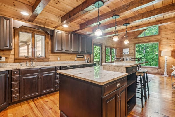 Spacious kitchen with wooden cabinets and granite countertops
