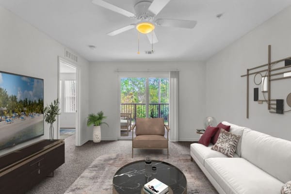 Bright living room with modern furnishings and a view