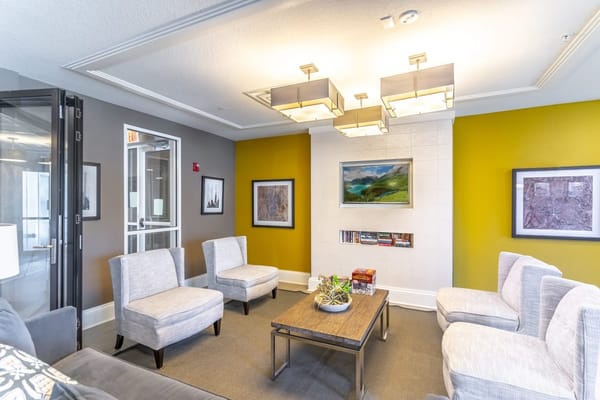 Bright common area with seating and artwork