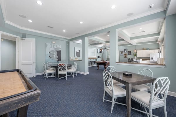 Interior view of a common area with seating and pool table