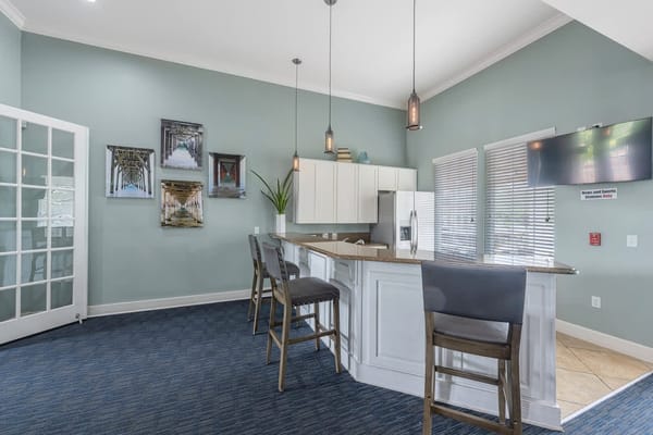 Bright common area with kitchen and seating