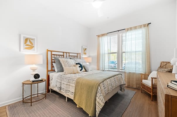 Cozy private bedroom with natural light and decor