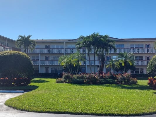 Exterior view of Century Village at Boca Raton with landscaping