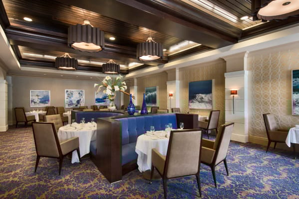 Upscale restaurant interior with tables set for dining