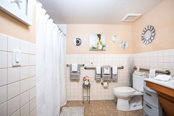 A well-decorated bathroom featuring towels and decor