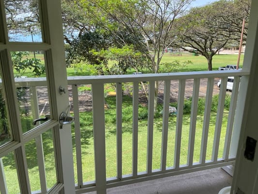 View from the balcony into a green area
