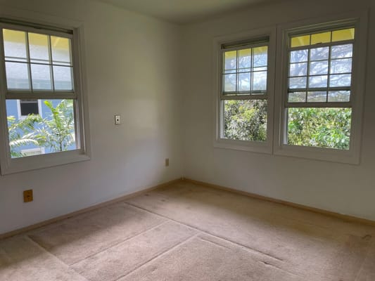 Simple interior view of a room with windows
