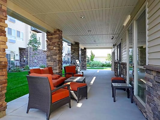 Covered outdoor seating area with furniture