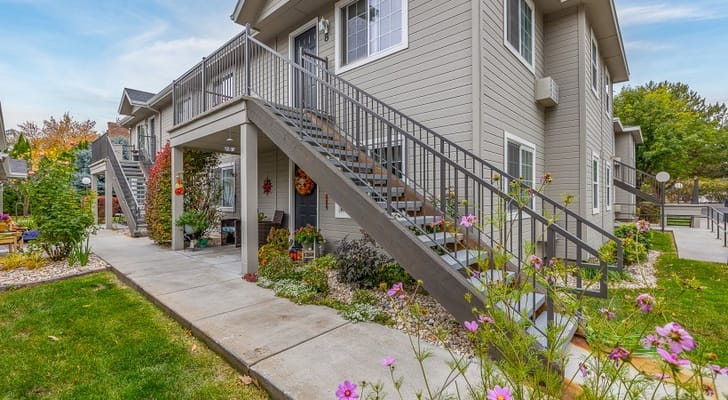 View of the entrance with stairway and landscaped path