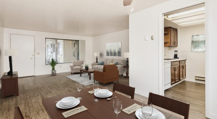 Spacious living area with dining table and kitchen view