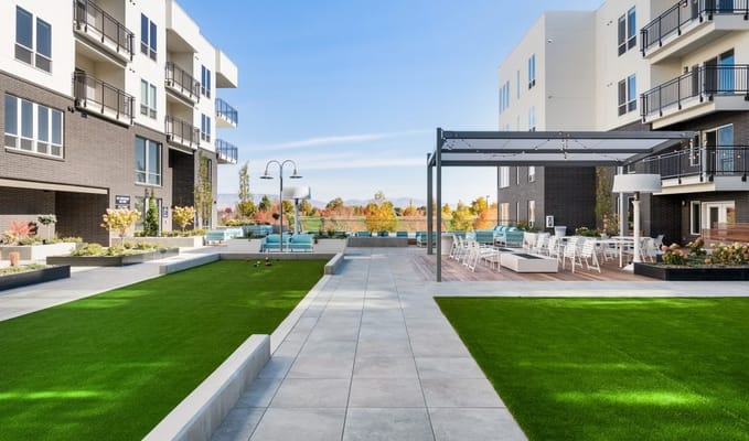 Outdoor space with seating and landscaped areas