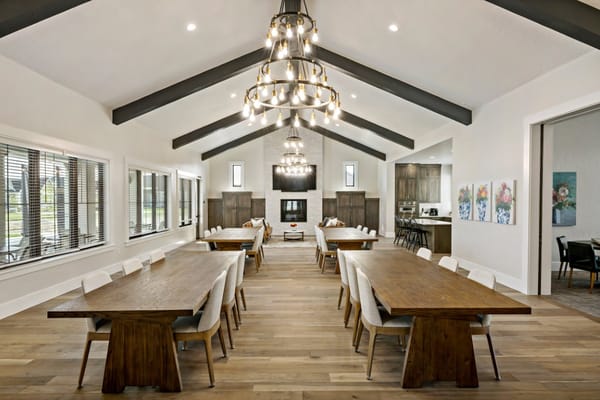Spacious dining room with wooden tables and stylish lighting