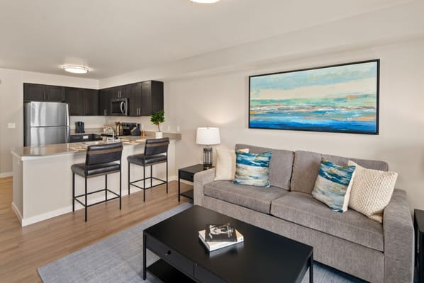 Modern interior of a living room with kitchen area