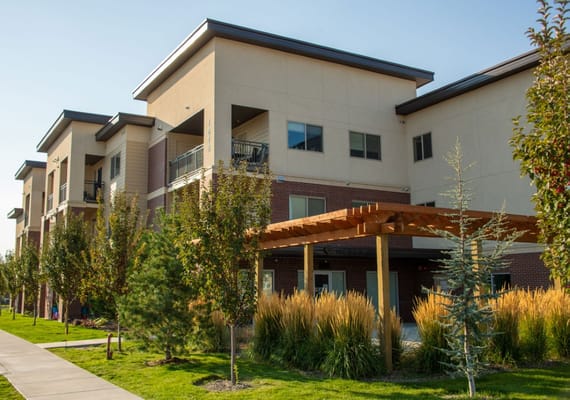 Exterior of Mercy Creek Apartments showcasing modern architecture and landscaped area.