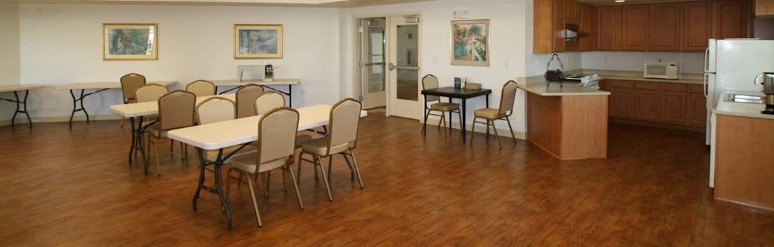 Spacious common area with tables and chairs