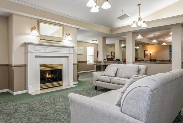 Cozy common area with seating and a fireplace