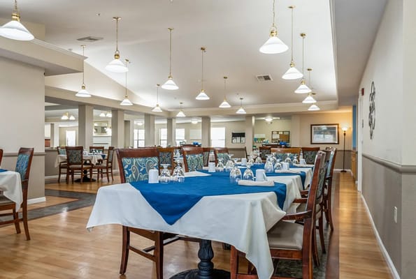 Well-set dining room with tables and chairs