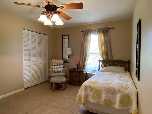 Bright private room with a bed and window