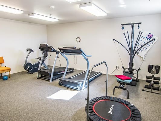 Interior view of a fitness room with exercise equipment