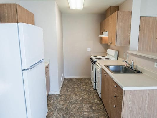 Interior view of a small kitchen in senior living apartments