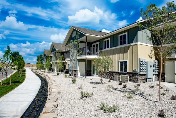 Exterior view of Bandon River Apartments with landscaping