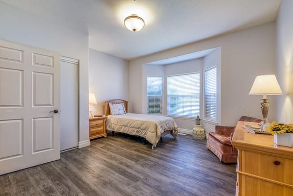 Cozy private room with a bed and window
